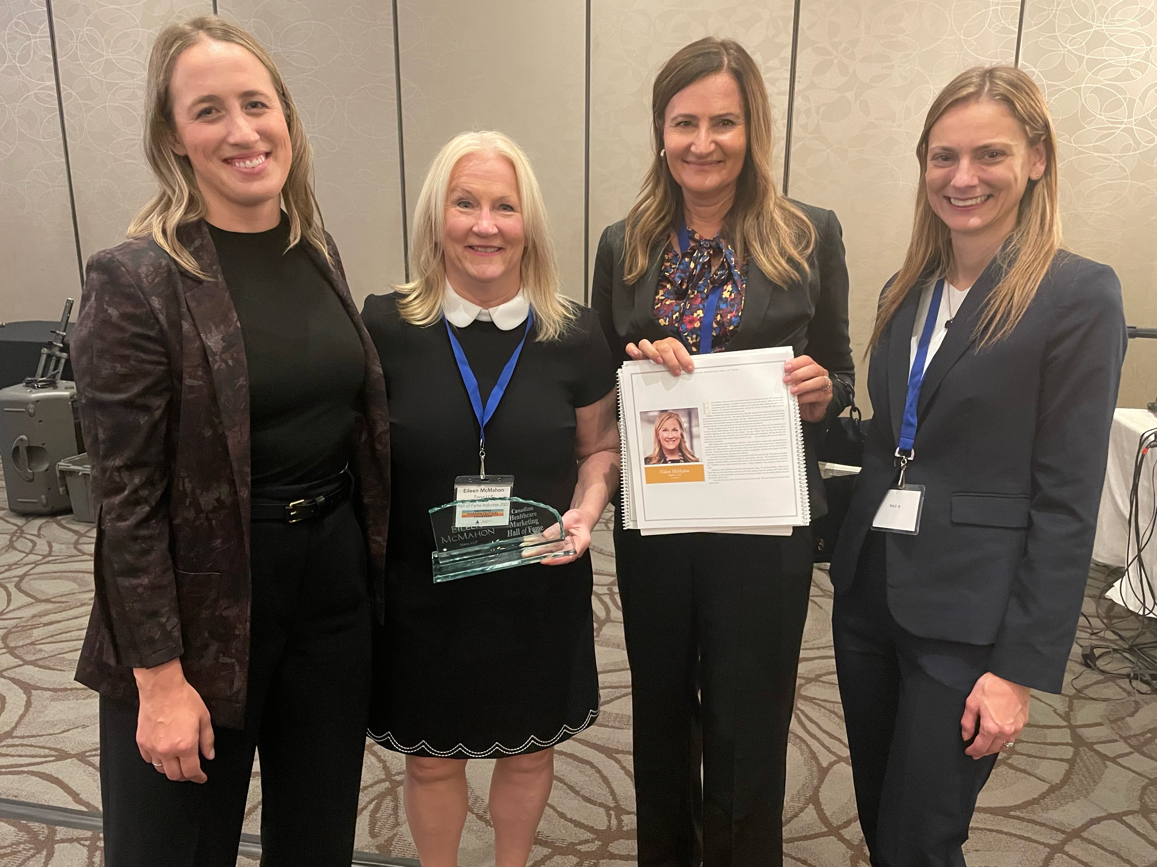 Four Torys lawyers stand in a line induction ceremony 