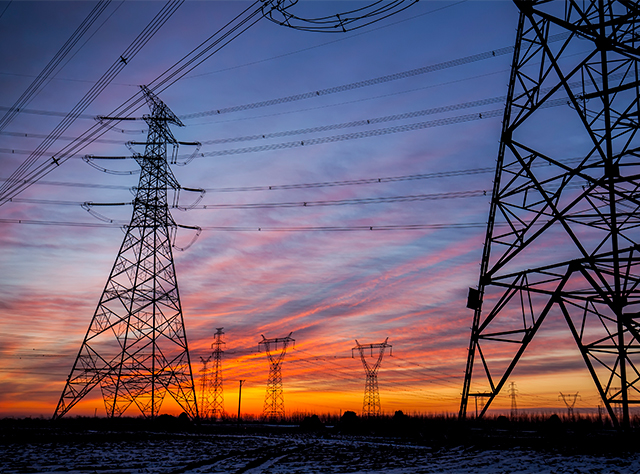 Electricity pylons at sunset